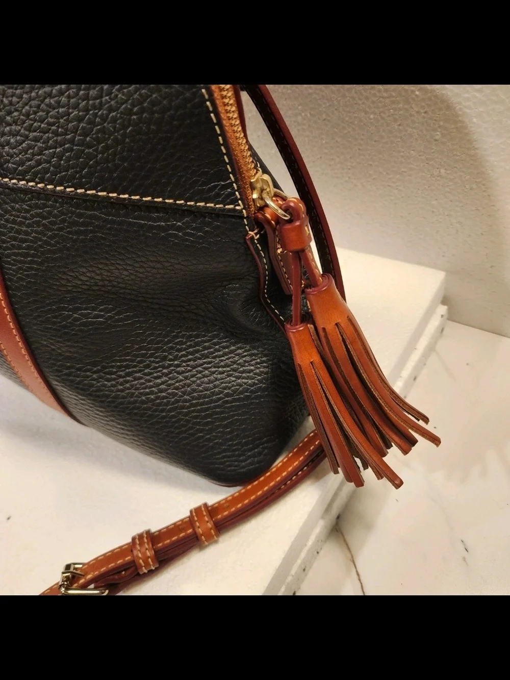 Dooney & Bourke Black Satchel with Brown Trim and Tassel